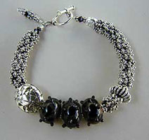 Lampwork Beads and Sterling silver bracelet by Vicky Jousan